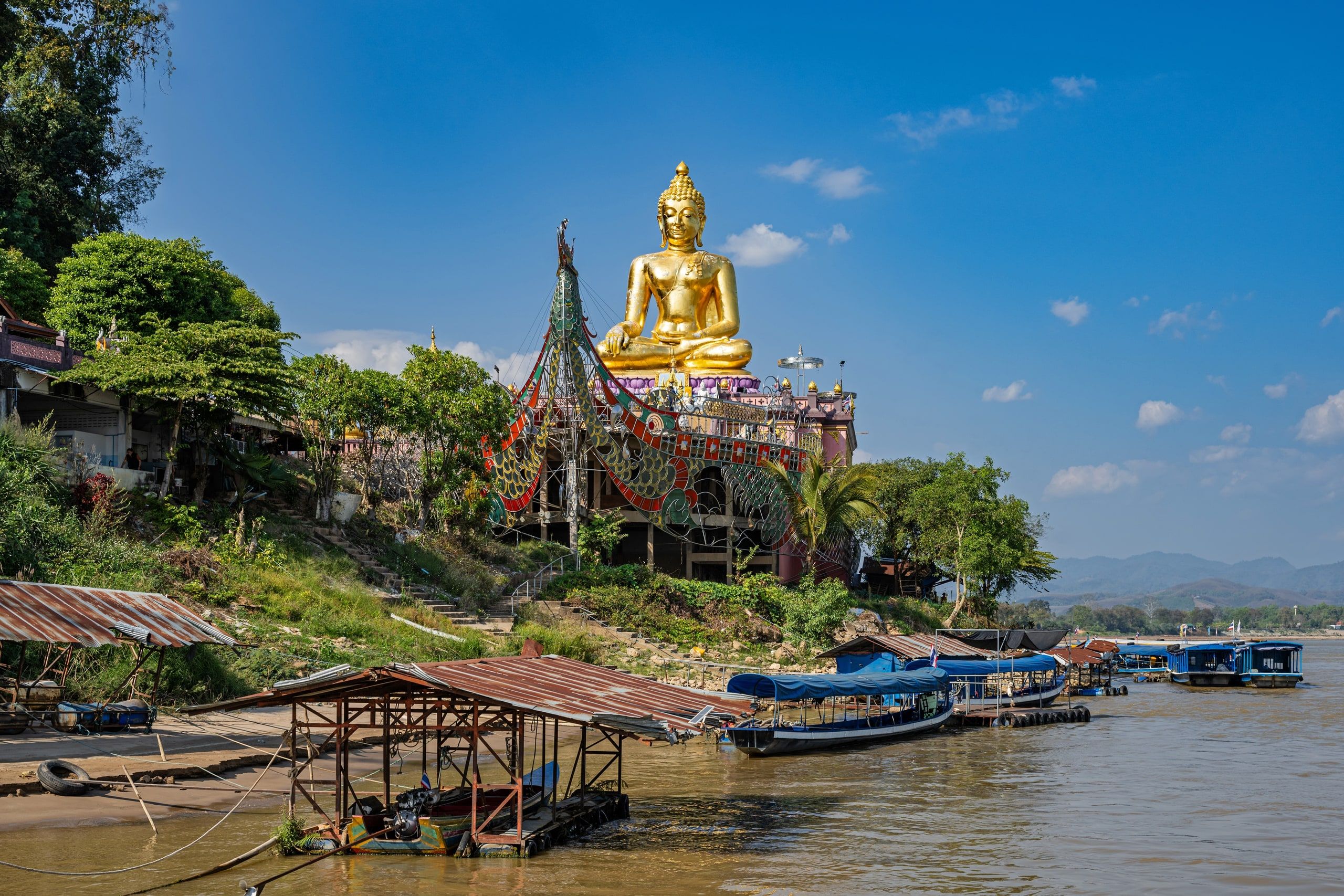 The golden Buddha of the Golden Triangle above the Mekong bank at Sop Ruak