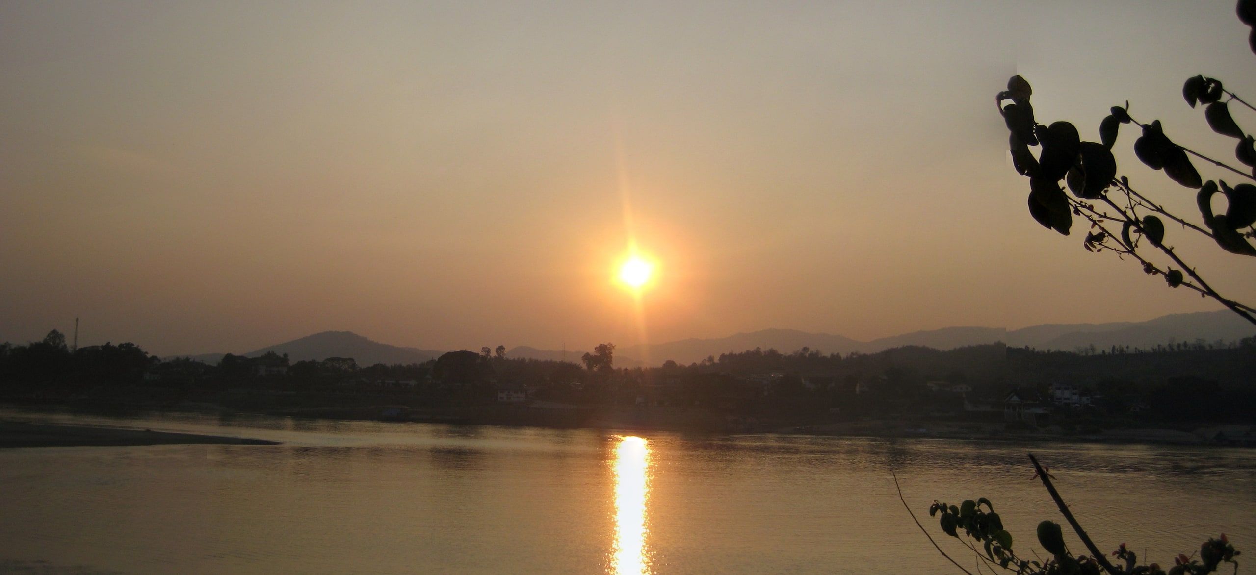The sun sets over the Mekong, seen from Huay Xai