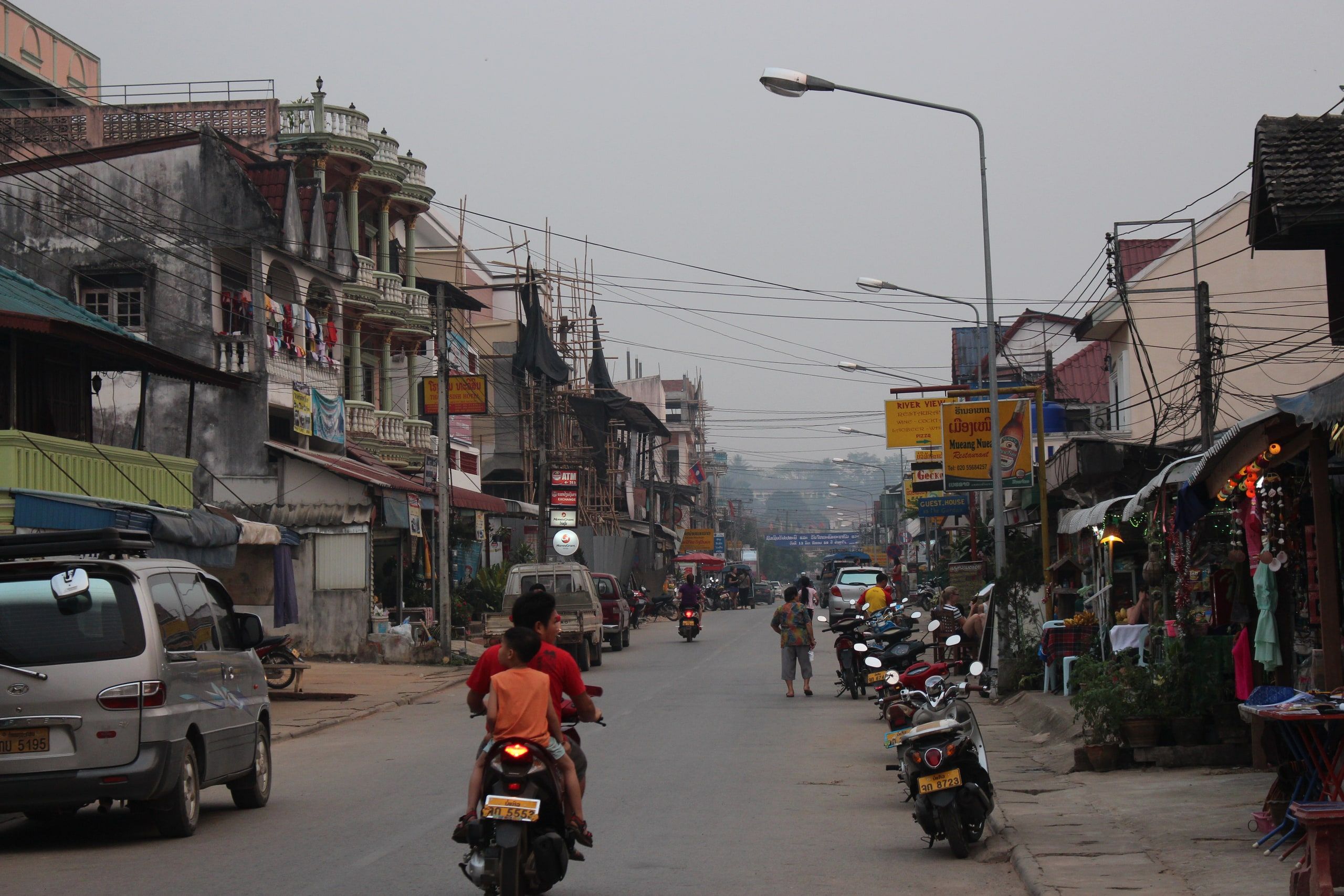 Huay Xai's main street, its shops and motorbikes