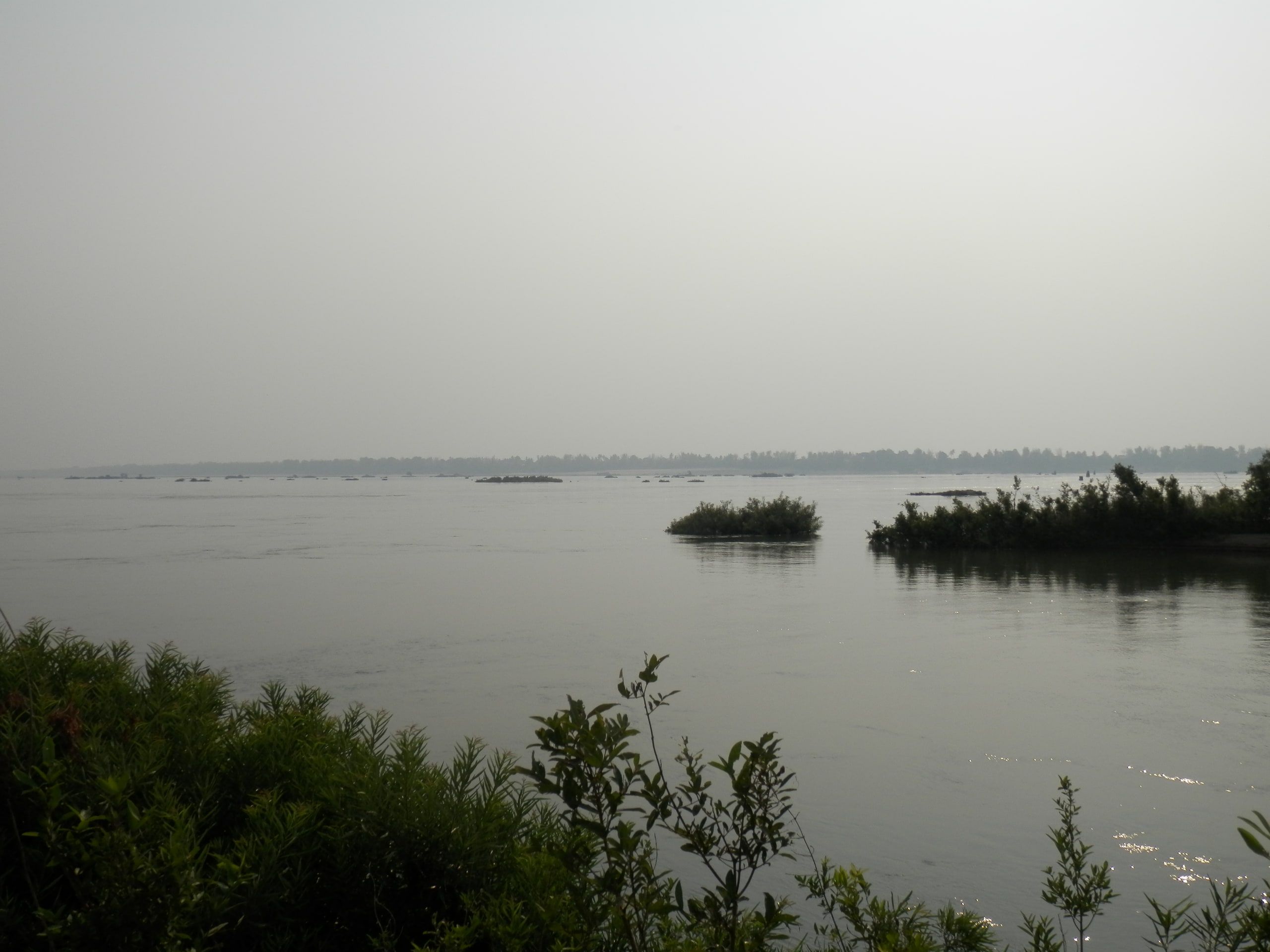 Wooded islands on the Mekong at Kratie, in the haze