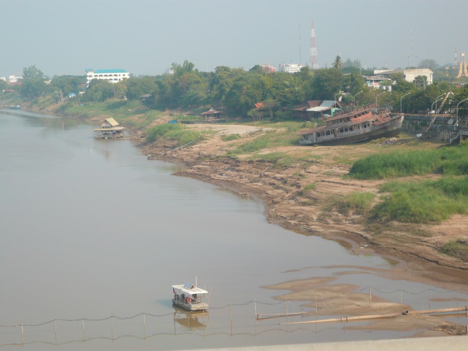 The Mekong in the dry season at Nong Khai, sandbanks and boats below the bank