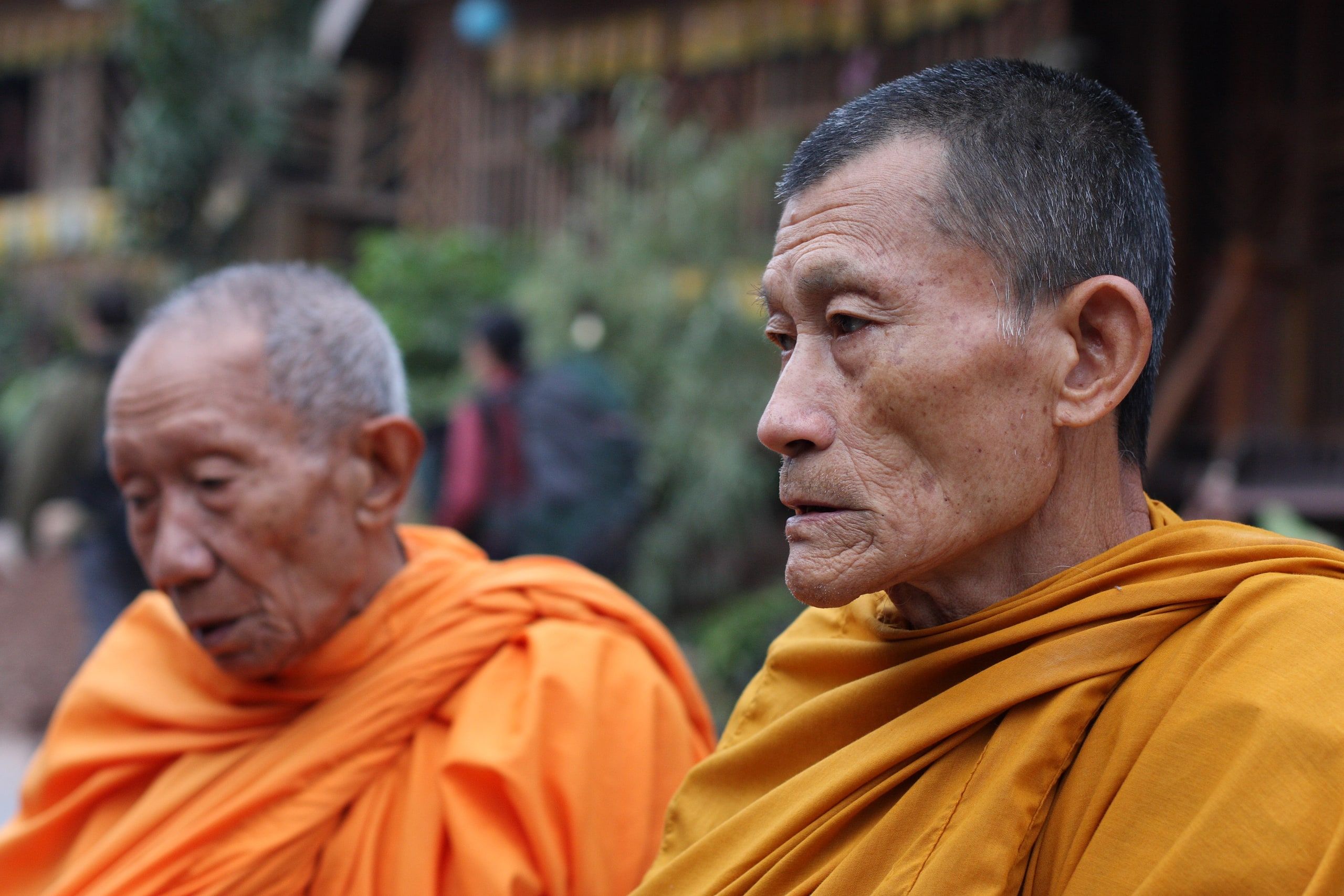 Two elderly monks in saffron robes in Pakbeng