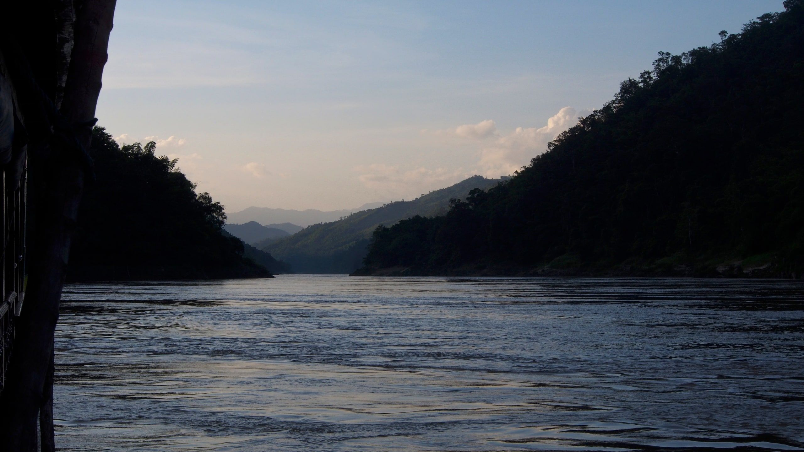 The Mekong at dusk between two jungle slopes, a few minutes from Pakbeng