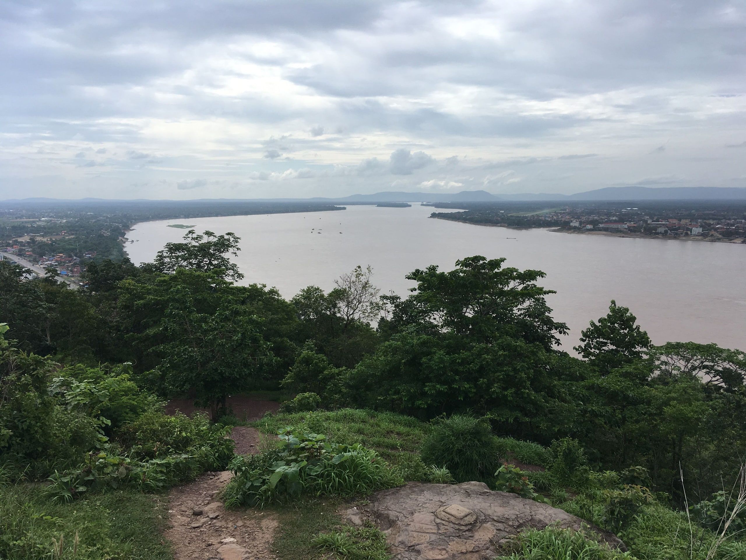 The Mekong seen from the golden Buddha of Phou Salao, the plain and mountains in the distance