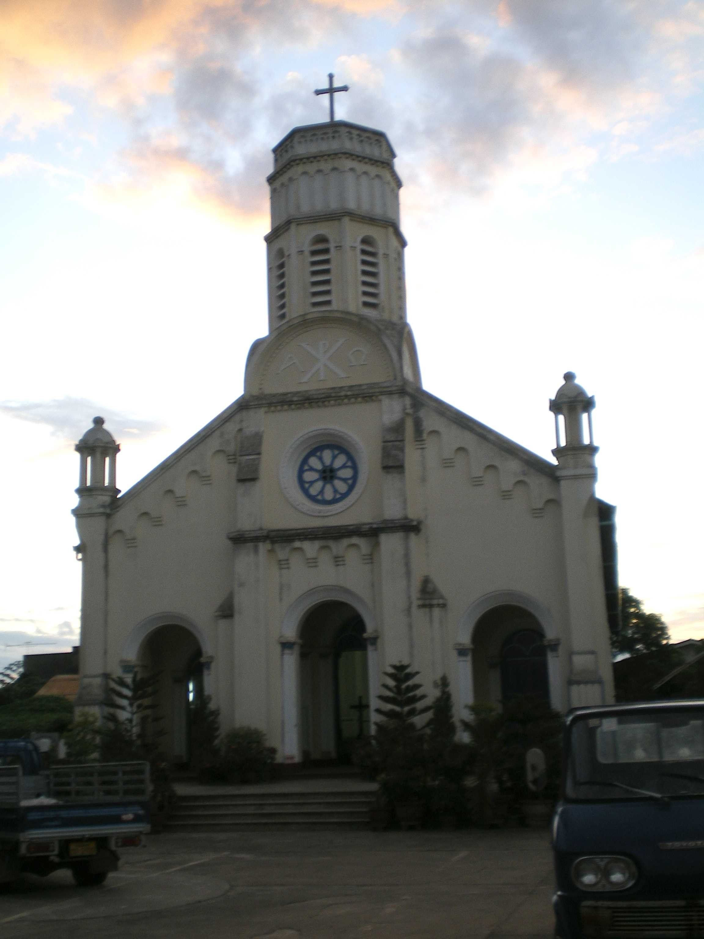 The white facade and bell tower of St Teresa's Church