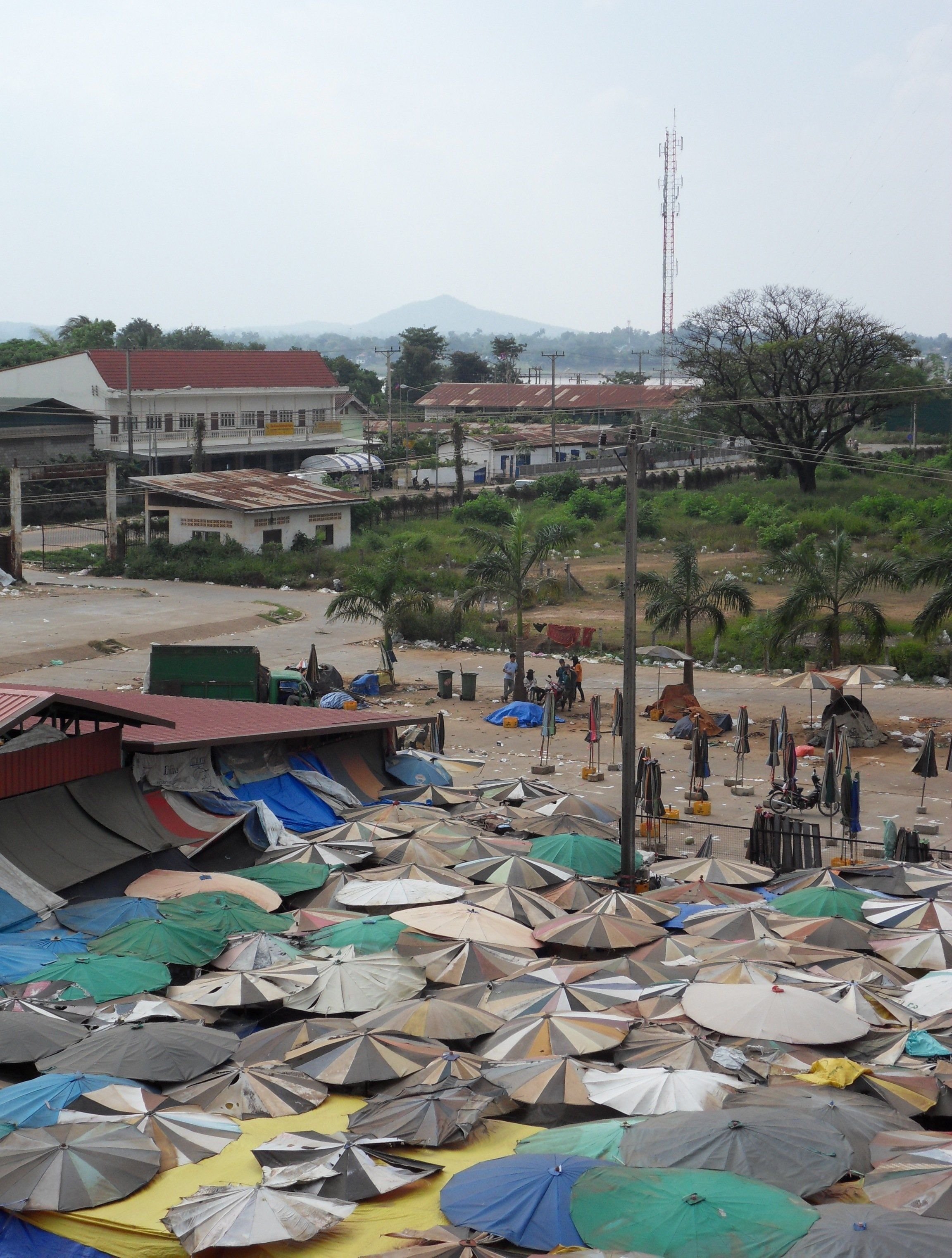 The roofs of Savannakhet market, with the Mekong and Thailand in the distance
