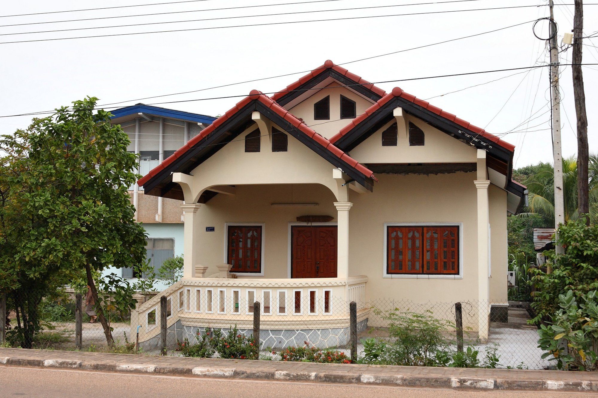 A house with red roofs and white columns