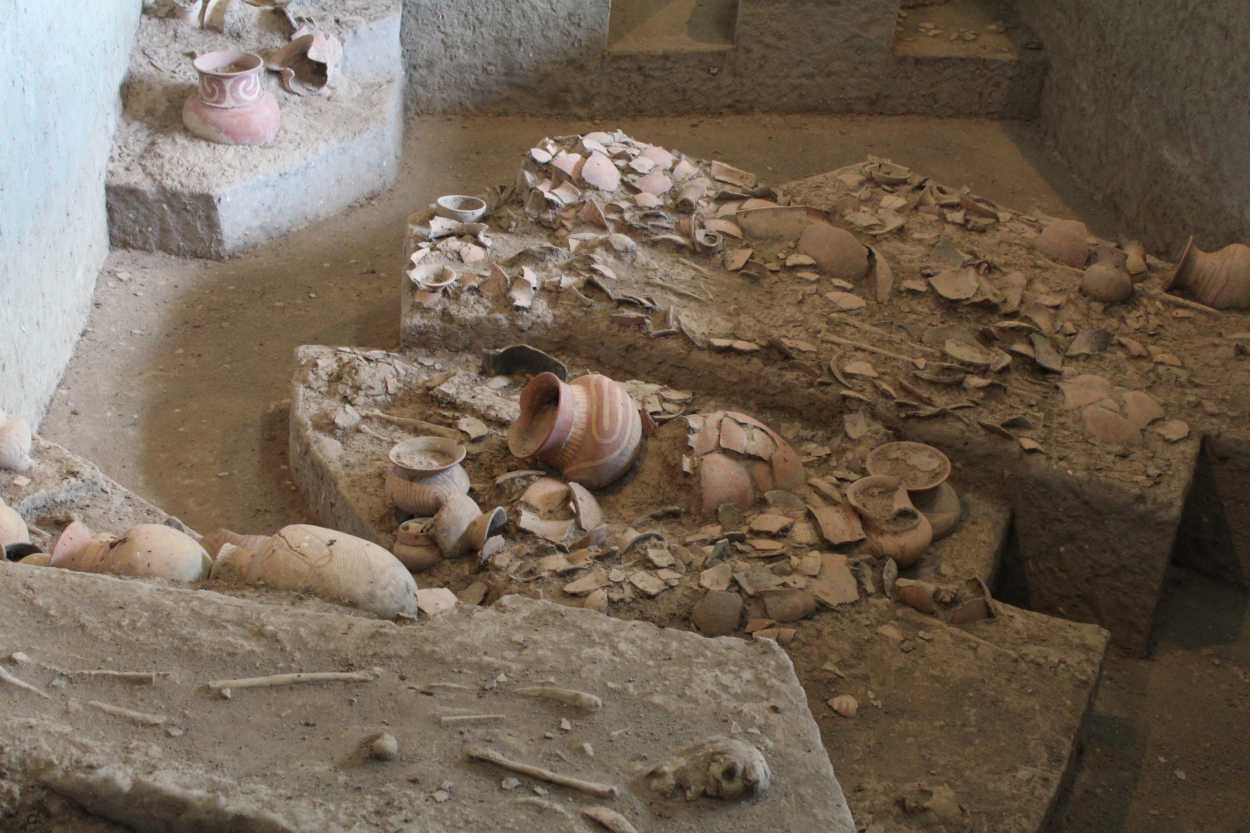 Pottery and bones in the excavation pit at Wat Pho Si Nai, Ban Chiang