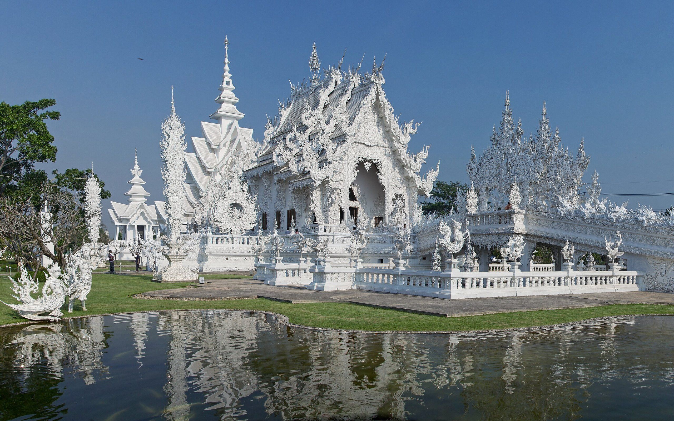 Chiang Rai's White Temple reflected in its pond